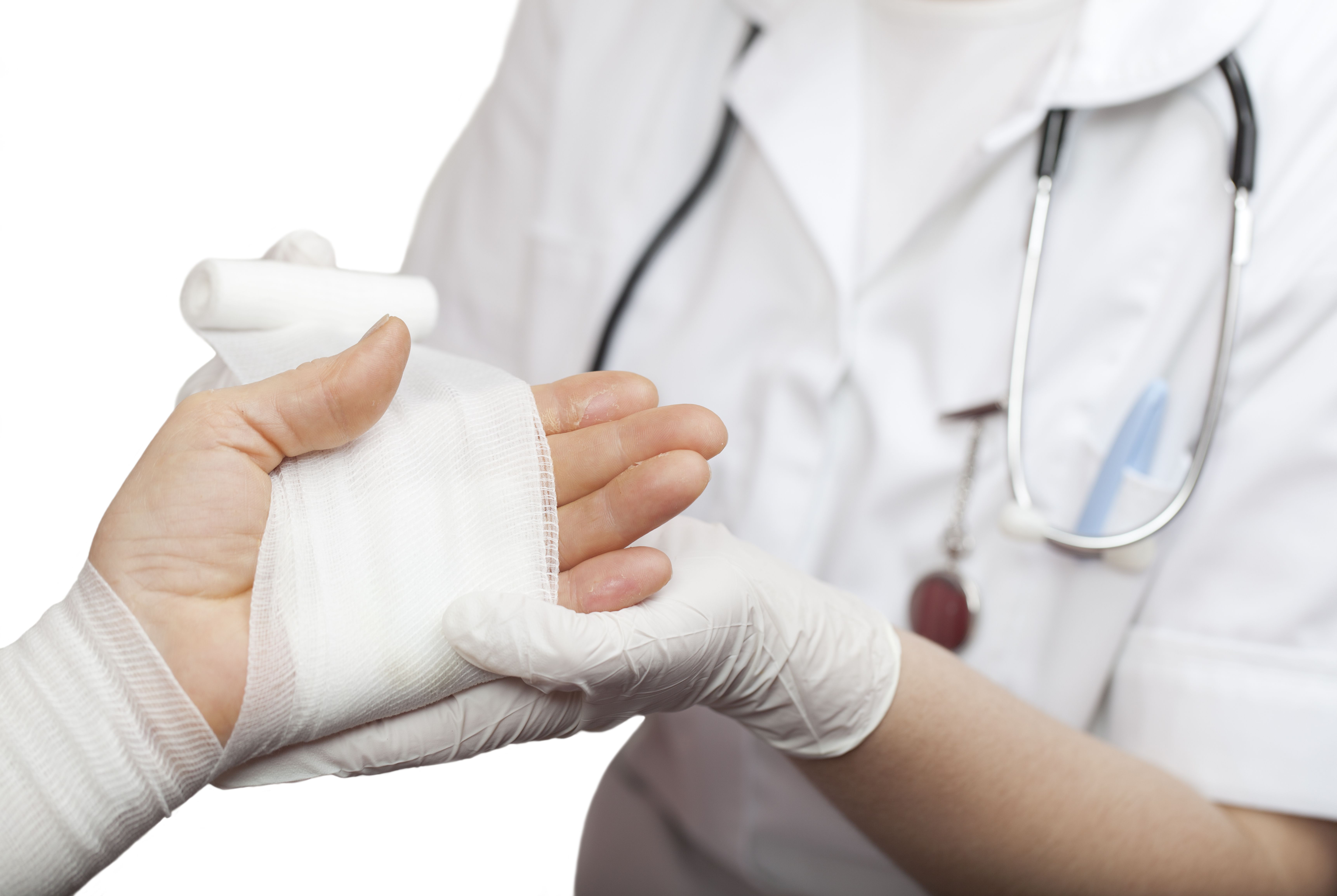 Nurse wrapping a burn victim's hand